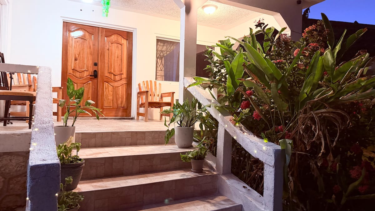 Front patio with wooden chairs